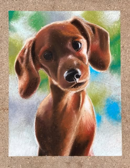 Warmly blended portrait of a brown dog in colored pencil