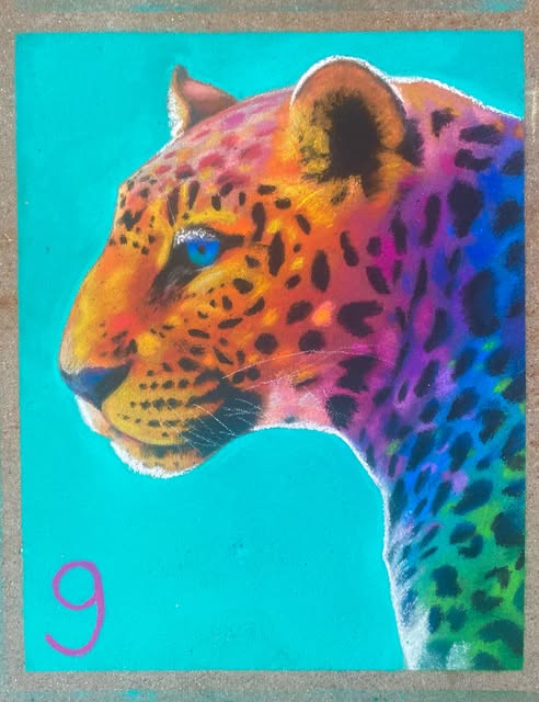 Vibrant chalk portrait of a leopard on pavement